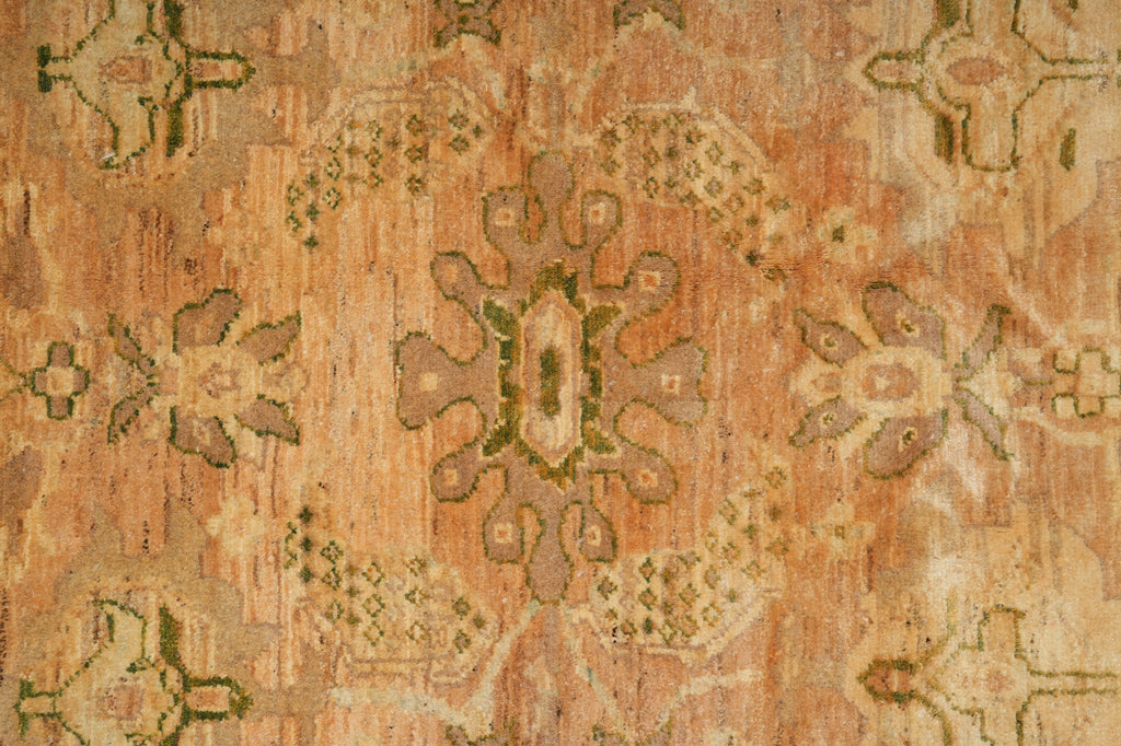 Close-up of a patterned rug with earthy tones