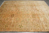 Load image into Gallery viewer, Vintage beige rug with intricate patterns on a wooden floor