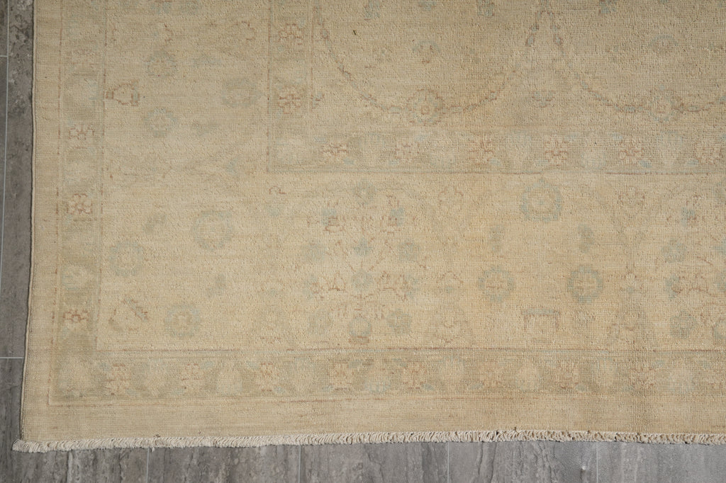 Beige patterned rug on a wooden floor