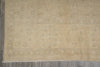 Load image into Gallery viewer, Beige patterned rug on a wooden floor