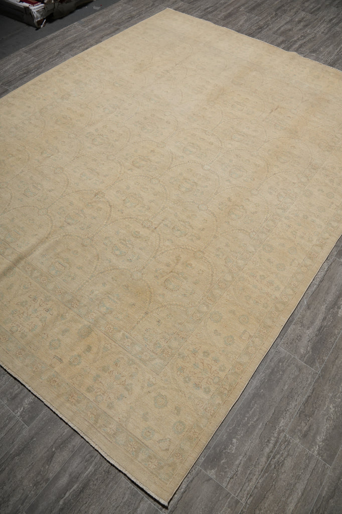 Beige patterned rug on a wooden floor