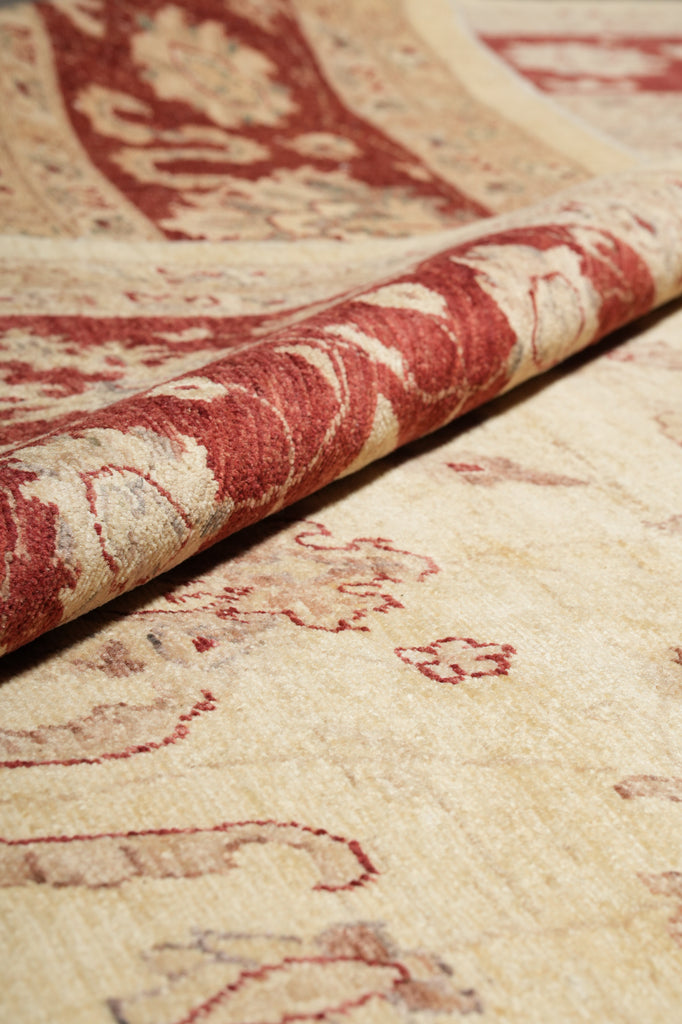 Close-up of a textured surface with red and beige patterns