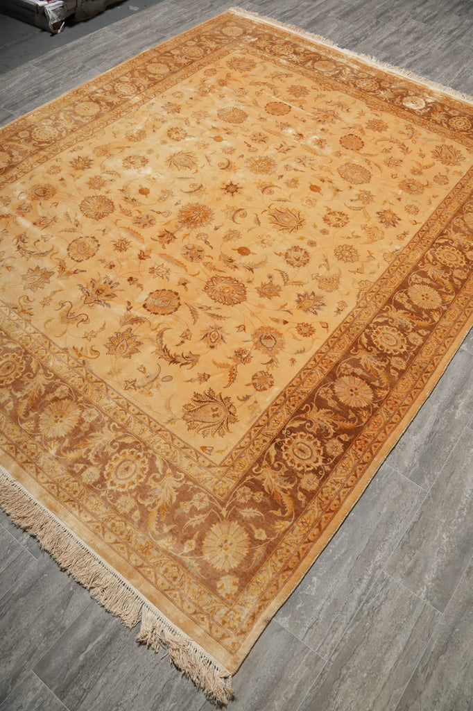 Decorative rug with intricate patterns on a gray floor