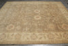 Load image into Gallery viewer, Beige area rug with floral patterns on a wooden floor