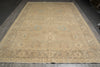 Load image into Gallery viewer, Beige patterned rug on a wooden floor