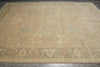 Load image into Gallery viewer, Beige area rug with intricate patterns on a wooden floor