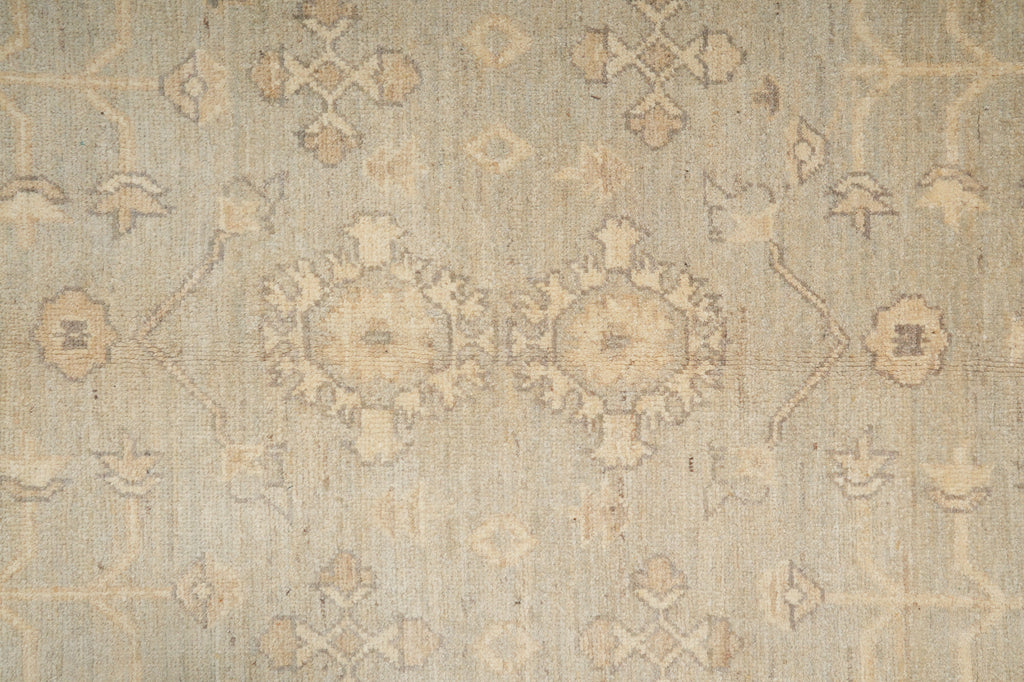 Patterned rug with geometric design in beige and brown tones