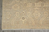 Load image into Gallery viewer, Close-up of a patterned rug with intricate designs on a gray floor.