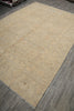 Load image into Gallery viewer, Beige patterned rug on a wooden floor