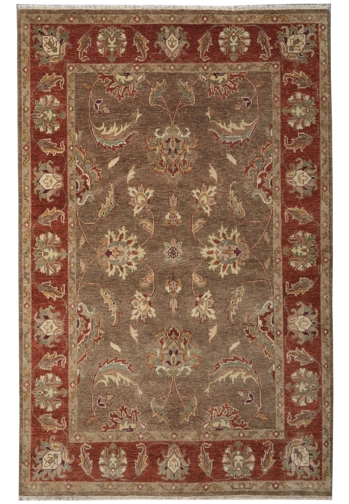 Decorative rug with intricate patterns in red and beige colors