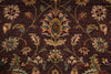 Load image into Gallery viewer, Close-up of a patterned rug with floral designs on a dark brown background