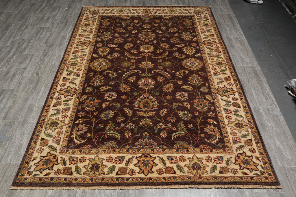 Decorative rug with intricate patterns on a wooden floor