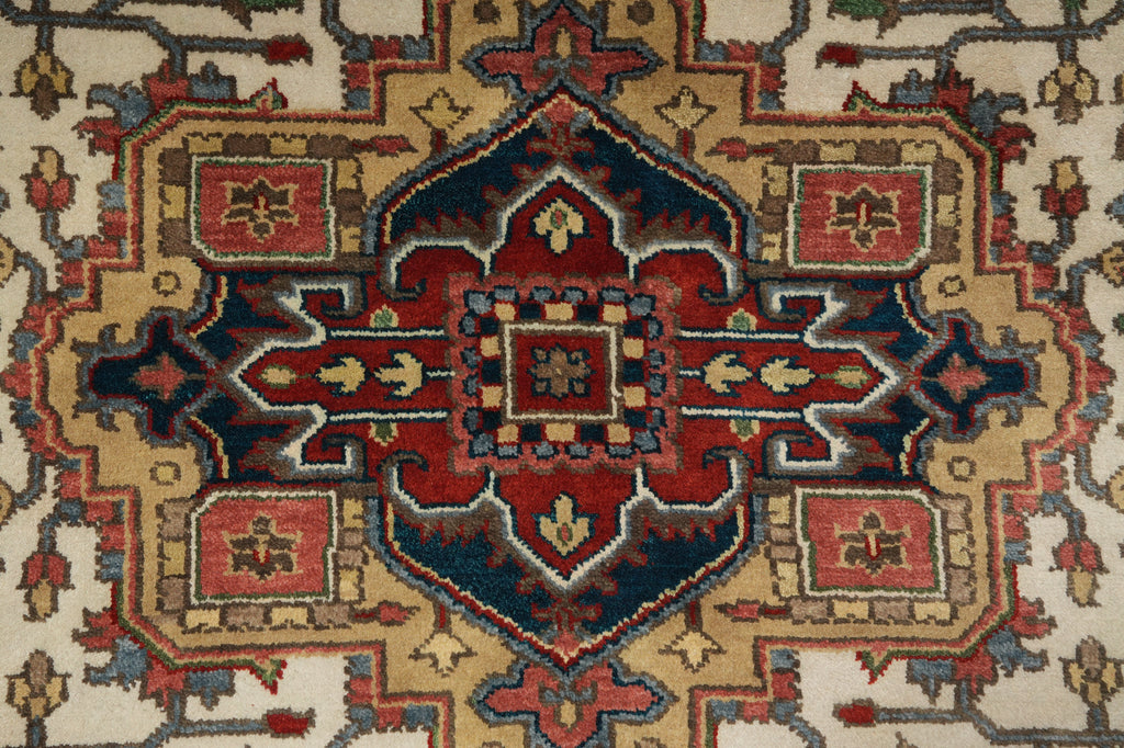 Close-up of a patterned rug with red, blue, and beige colors.