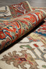 Load image into Gallery viewer, Close-up of a patterned rug with intricate designs.