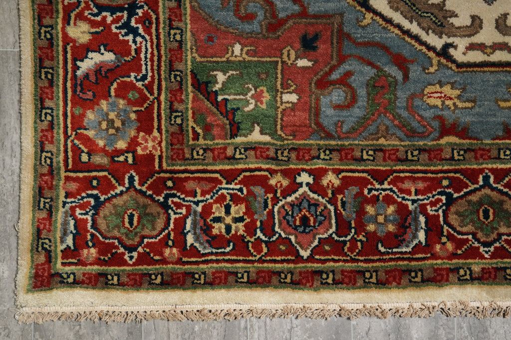 Decorative rug with intricate patterns on a gray floor