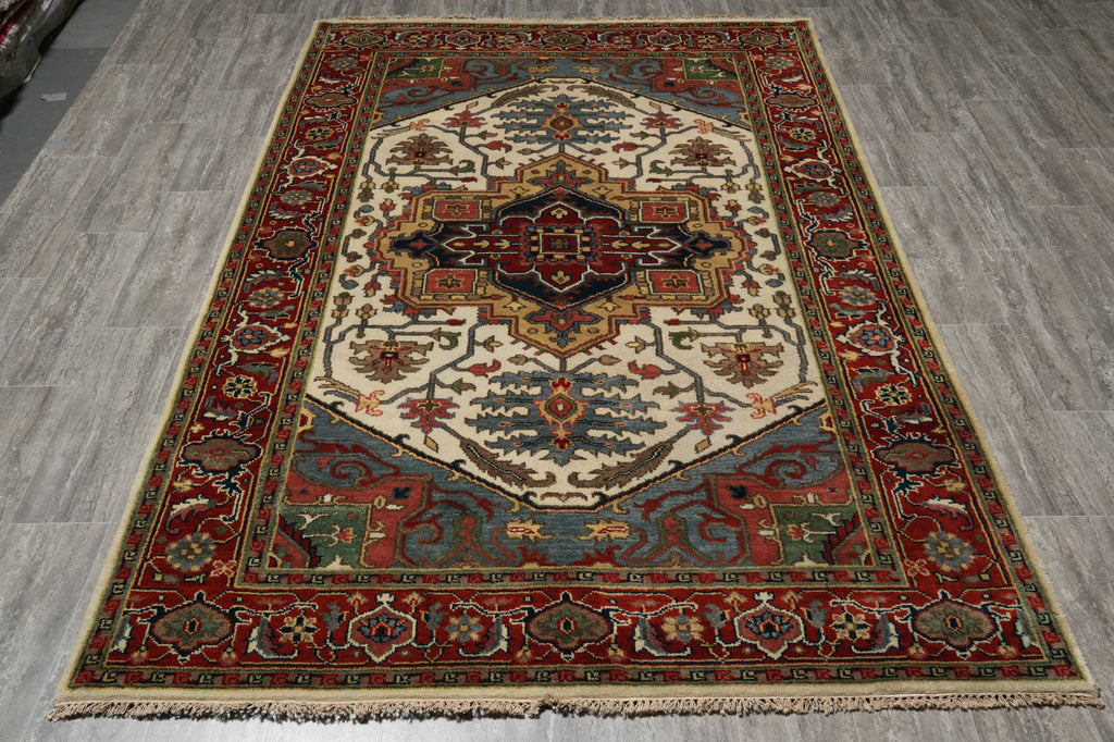 Decorative rug with intricate patterns on a wooden floor