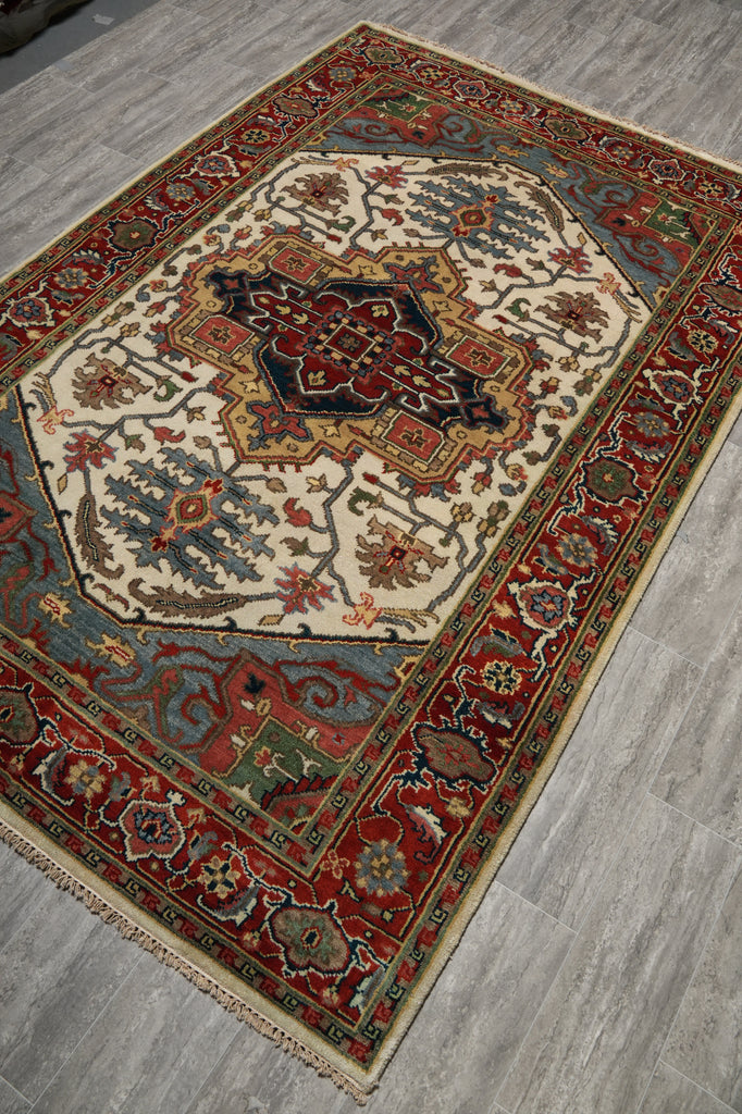 Decorative rug with intricate patterns on a wooden floor