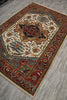 Load image into Gallery viewer, Decorative rug with intricate patterns on a wooden floor