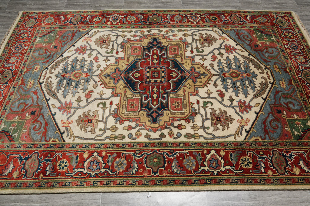 Decorative rug with intricate patterns on a wooden floor