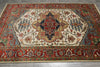 Load image into Gallery viewer, Decorative rug with intricate patterns on a wooden floor
