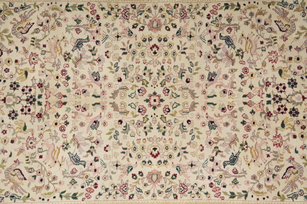 Decorative fabric with intricate patterns and colors on a beige background