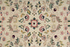 Load image into Gallery viewer, Close-up of a floral patterned rug with intricate details on a beige background.