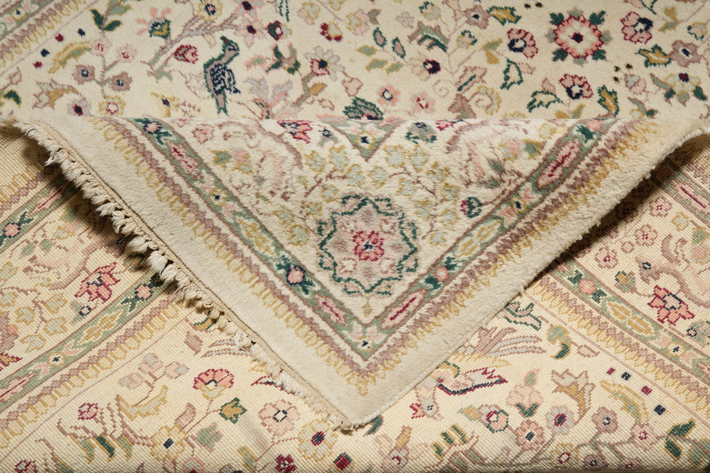 Close-up of a patterned rug with intricate designs and colors.