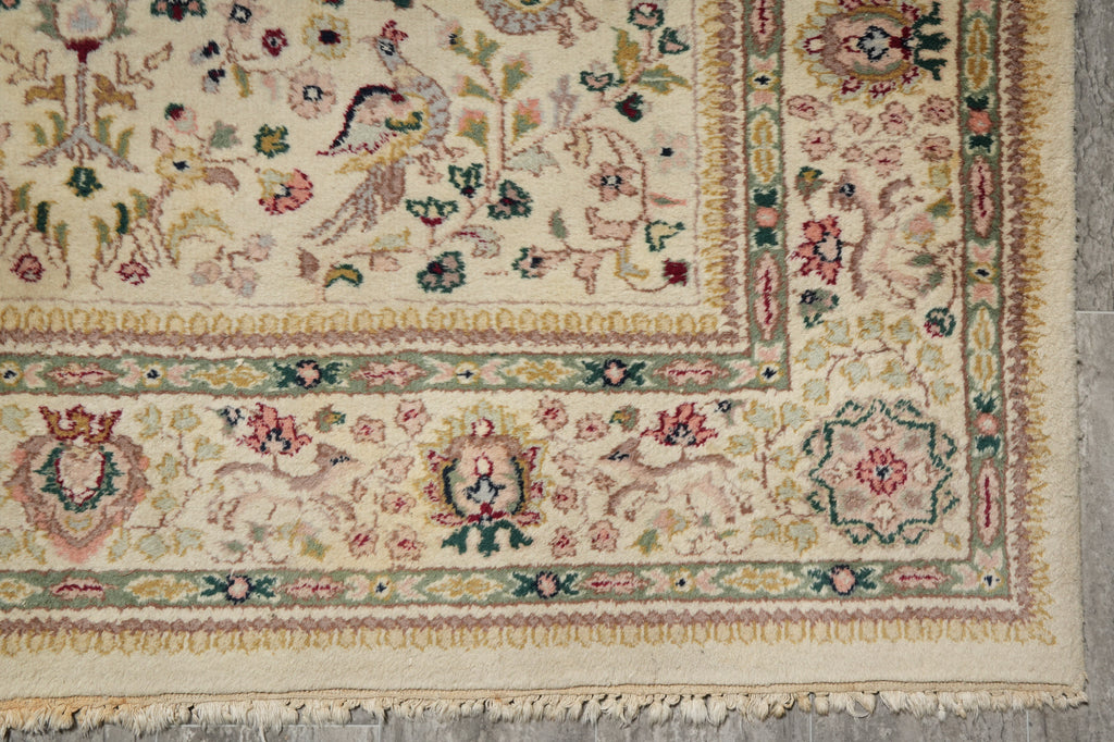 Close-up of a patterned rug with intricate designs on a neutral background