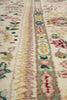 Load image into Gallery viewer, Close-up of a patterned fabric with floral and geometric designs.