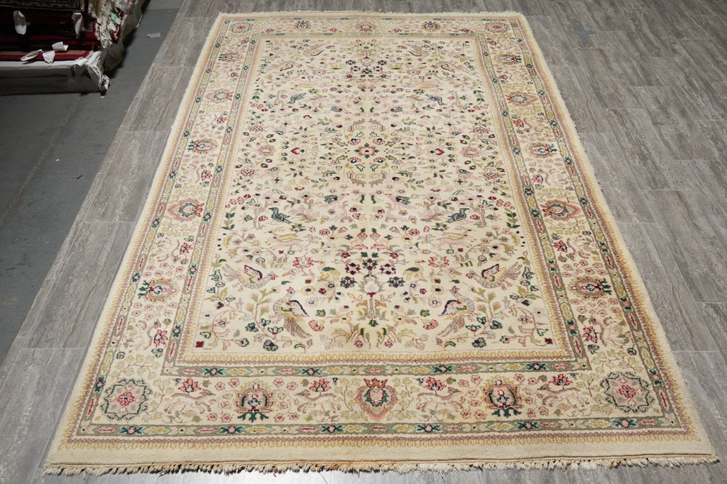 Decorative rug with intricate patterns on a wooden floor
