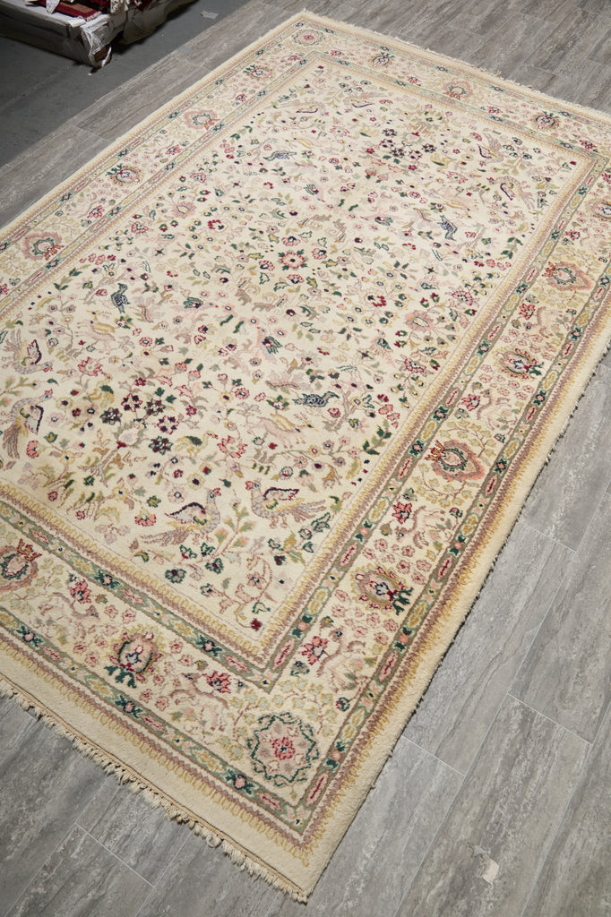 Decorative rug with intricate patterns on a wooden floor