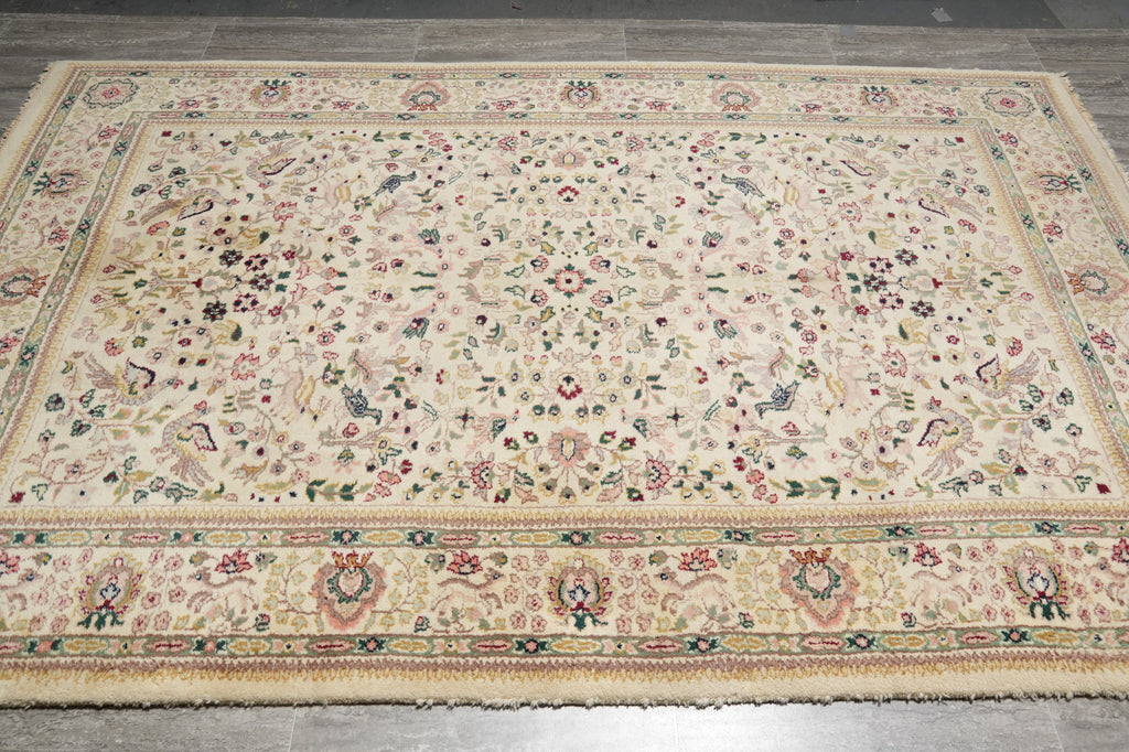 Decorative rug with floral patterns on a wooden floor