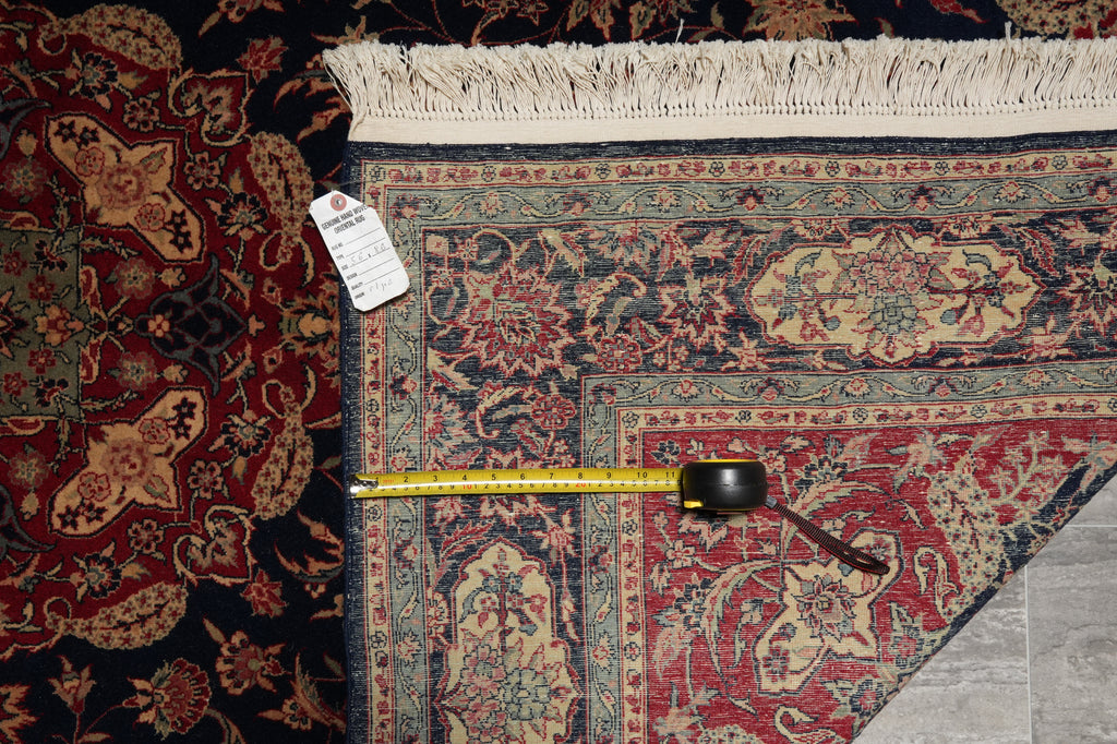Patterned rug with a measuring tape and price tag on a carpeted floor.