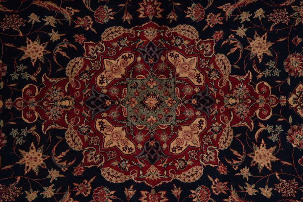 Close-up of a patterned rug with intricate designs.