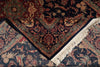 Load image into Gallery viewer, Close-up of a patterned rug with intricate designs and fringes.
