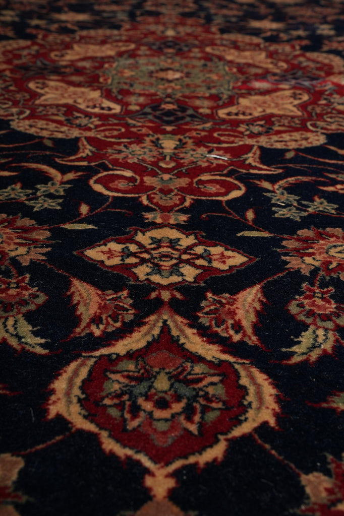 Close-up of a patterned rug with intricate designs.