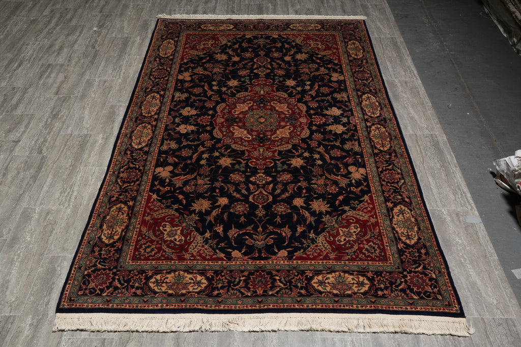 Decorative rug with intricate patterns on a wooden floor