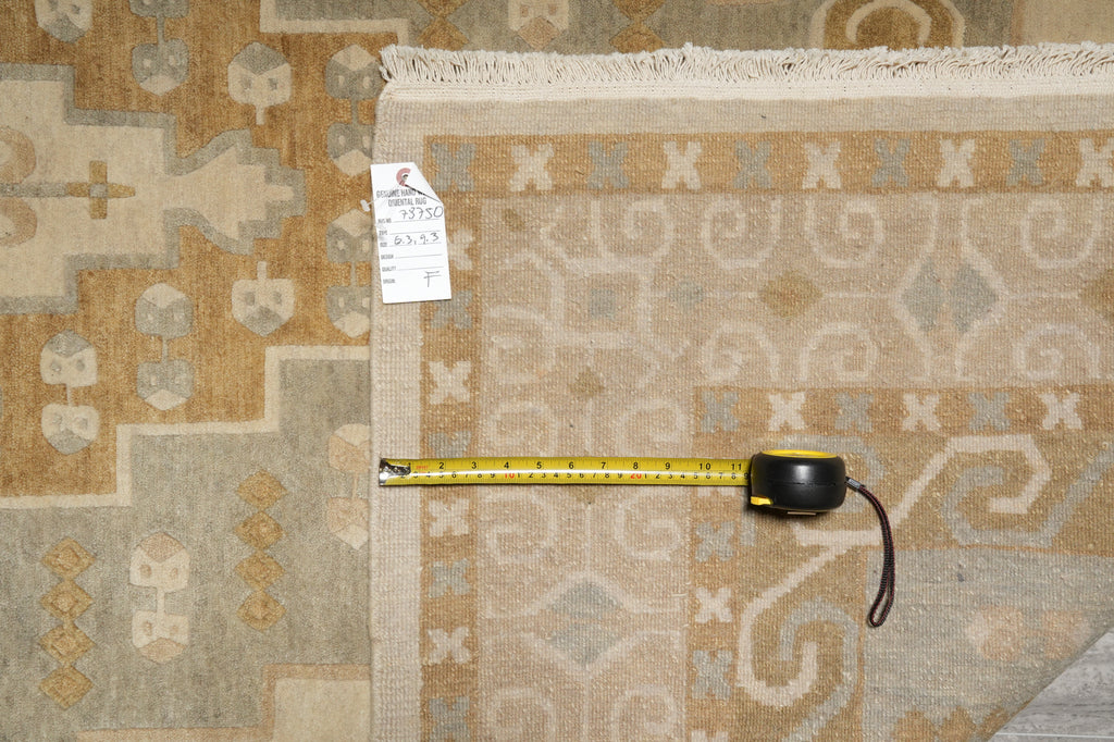 Two patterned rugs with a measuring tape on top, one with a price tag.
