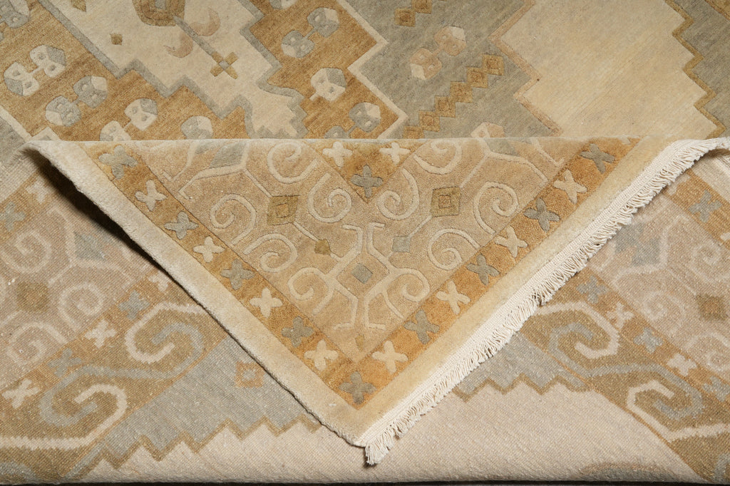 Close-up of a patterned beige and brown rug