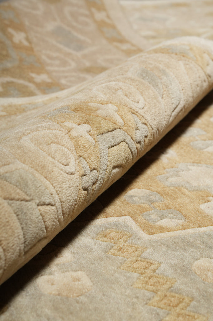 Close-up of textured beige fabric with intricate patterns