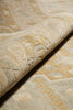Load image into Gallery viewer, Close-up of textured beige fabric with intricate patterns