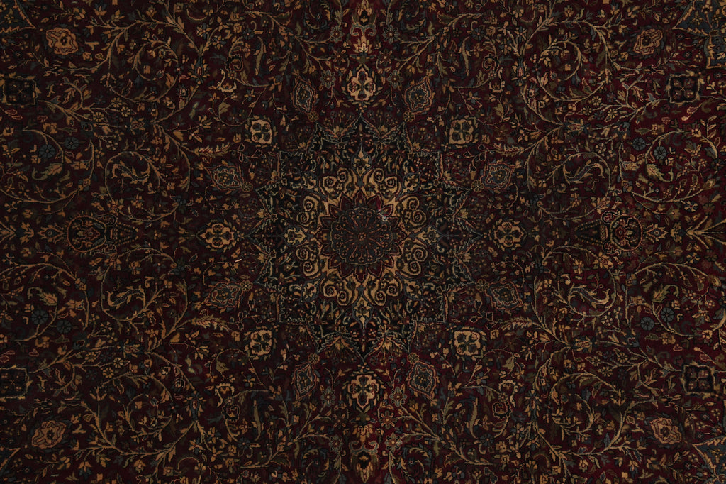 Close-up of a dark brown patterned fabric with intricate designs.