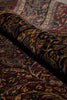 Load image into Gallery viewer, Close-up of a patterned rug with intricate designs.