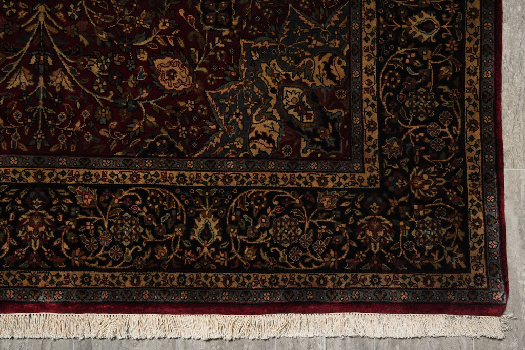 Close-up of an ornate rug with intricate patterns on a neutral background