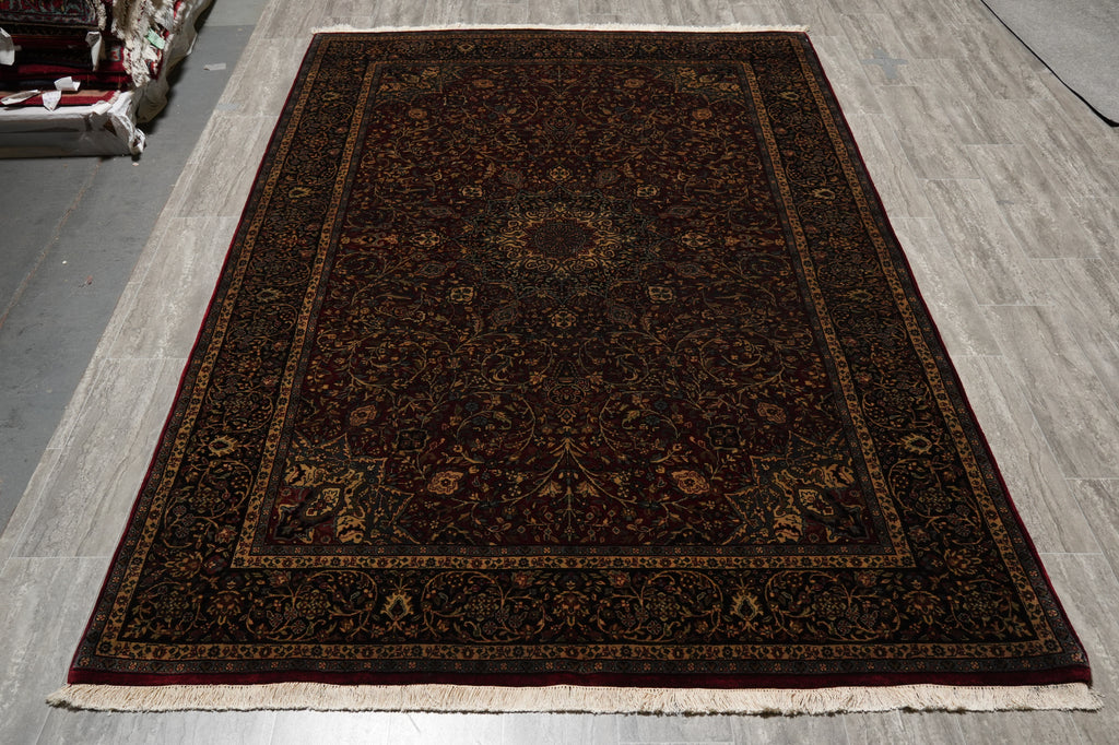 Decorative rug with intricate patterns on a wooden floor
