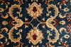 Load image into Gallery viewer, Close-up of a patterned rug with intricate designs on a blue background