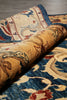 Load image into Gallery viewer, Close-up of a rolled-up patterned rug with intricate designs.