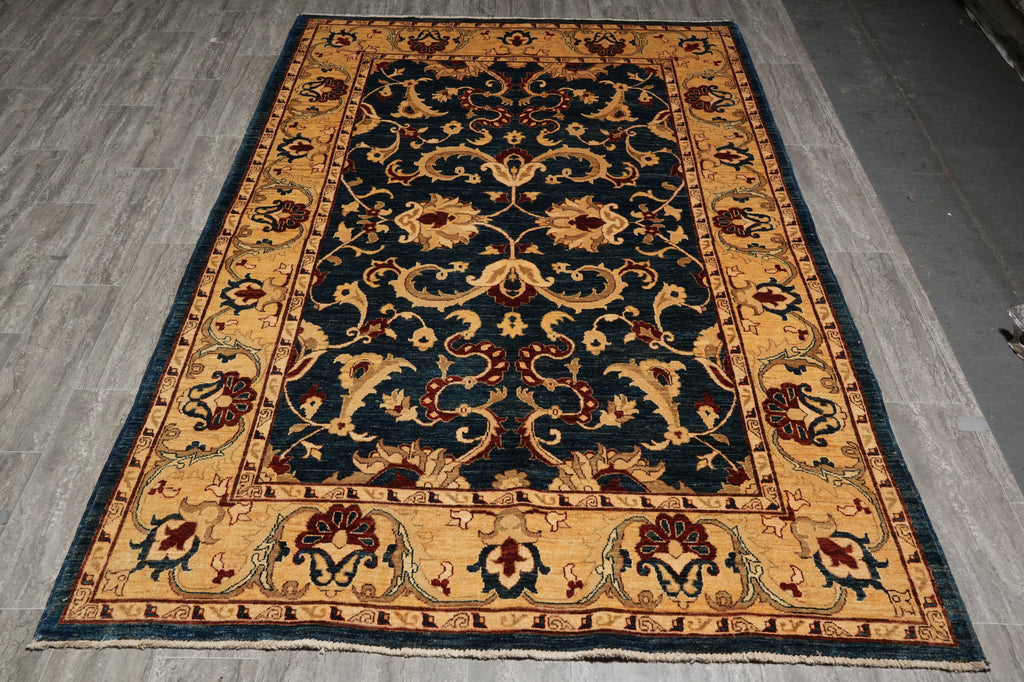 Decorative rug with intricate patterns on a gray floor