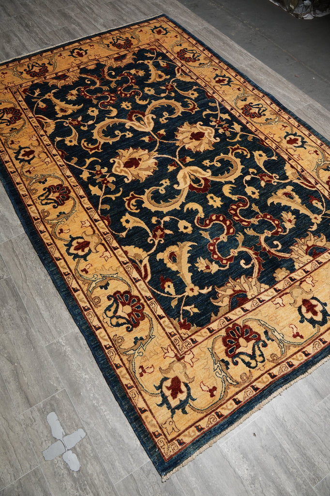Decorative rug with intricate patterns on a wooden floor