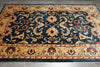 Load image into Gallery viewer, Decorative rug with intricate patterns on a wooden floor